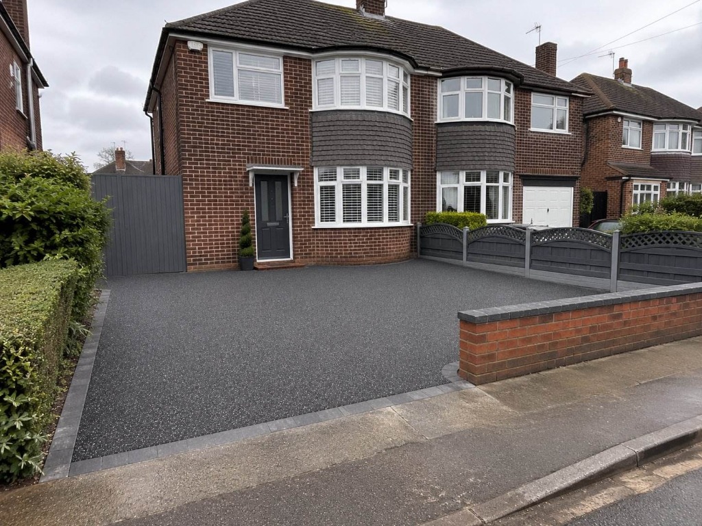 Anthracite resin bound driveway on semi-detached property with matching gate and fence