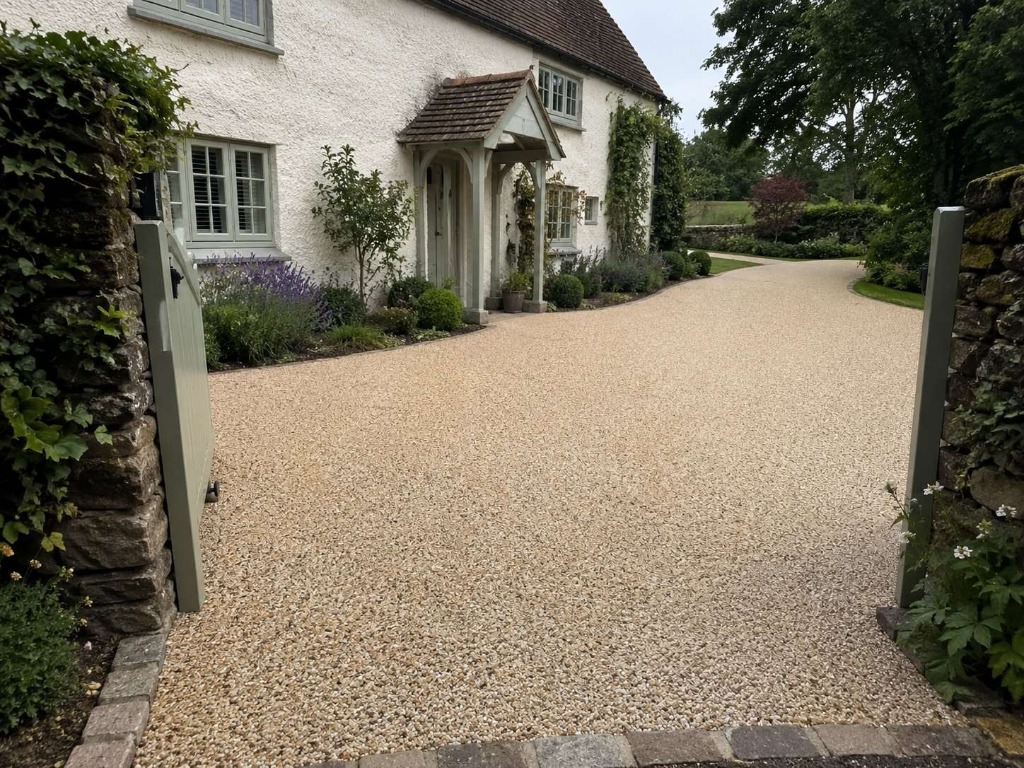 Caramel Latte resin bound long country driveway with cottage property by Windsor Resin Driveways