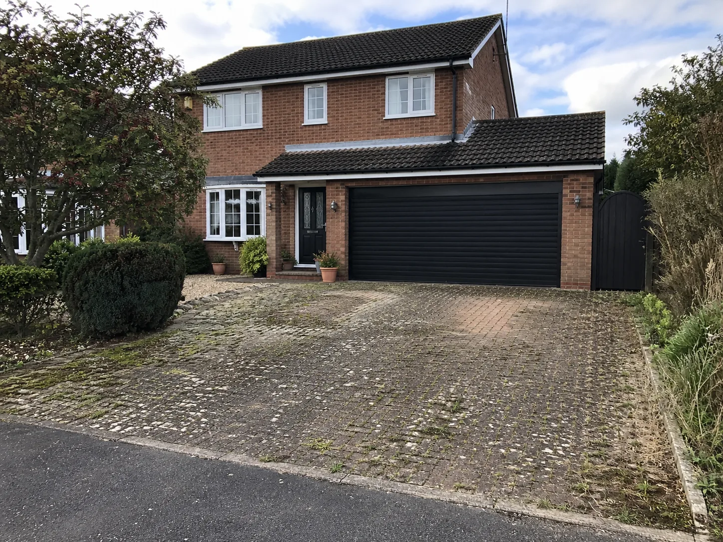 Worn and cracked driveway before resin bound installation